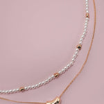 Double layer pearl and gold chain necklace with bean charm