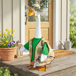 Porch goose statue dressed in a seasonal outfit