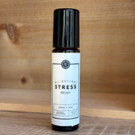 Rowe Casa Roll-on bottle labeled 'All Natural Stress Relief' on a wooden surface