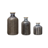 Set of three blue embossed stoneware vases in varying heights
