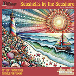 Jigsaw puzzle box for Seashells by the Seashore, featuring a lighthouse and sailboat coastal scene