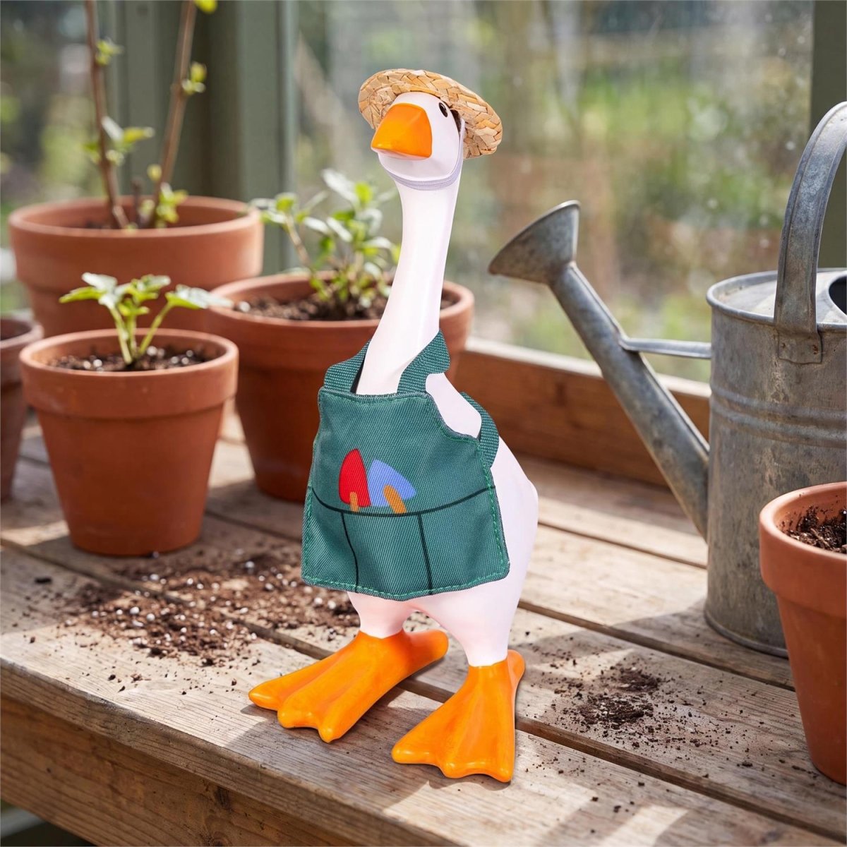 Table-sized goose figurine dressed in a mini outfit