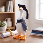 Table-sized goose figurine dressed in a mini outfit