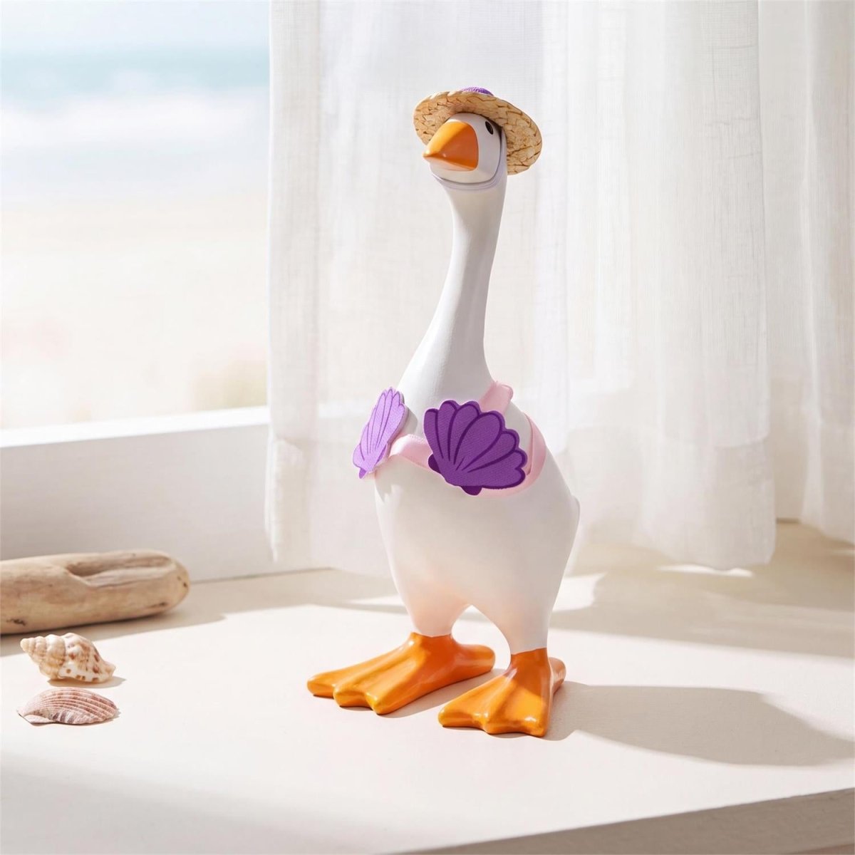 Table-sized goose figurine dressed in a mini outfit