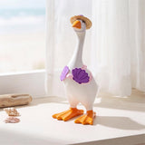 Table-sized goose figurine dressed in a mini outfit