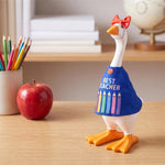 Table-sized goose figurine dressed in a mini outfit