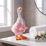 Table-sized goose figurine dressed in a mini outfit