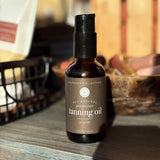 Bottle of tanning oil on a wooden surface with a blurred background