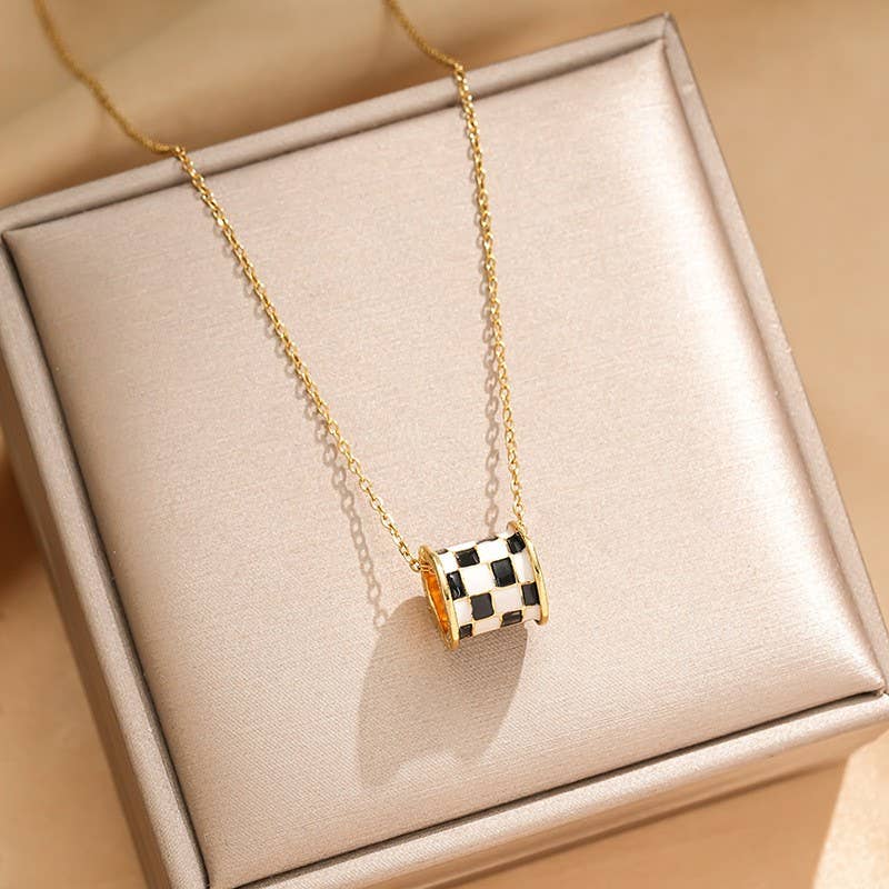 Tarnish-free stainless steel barrel necklace with checkered enamel pendant