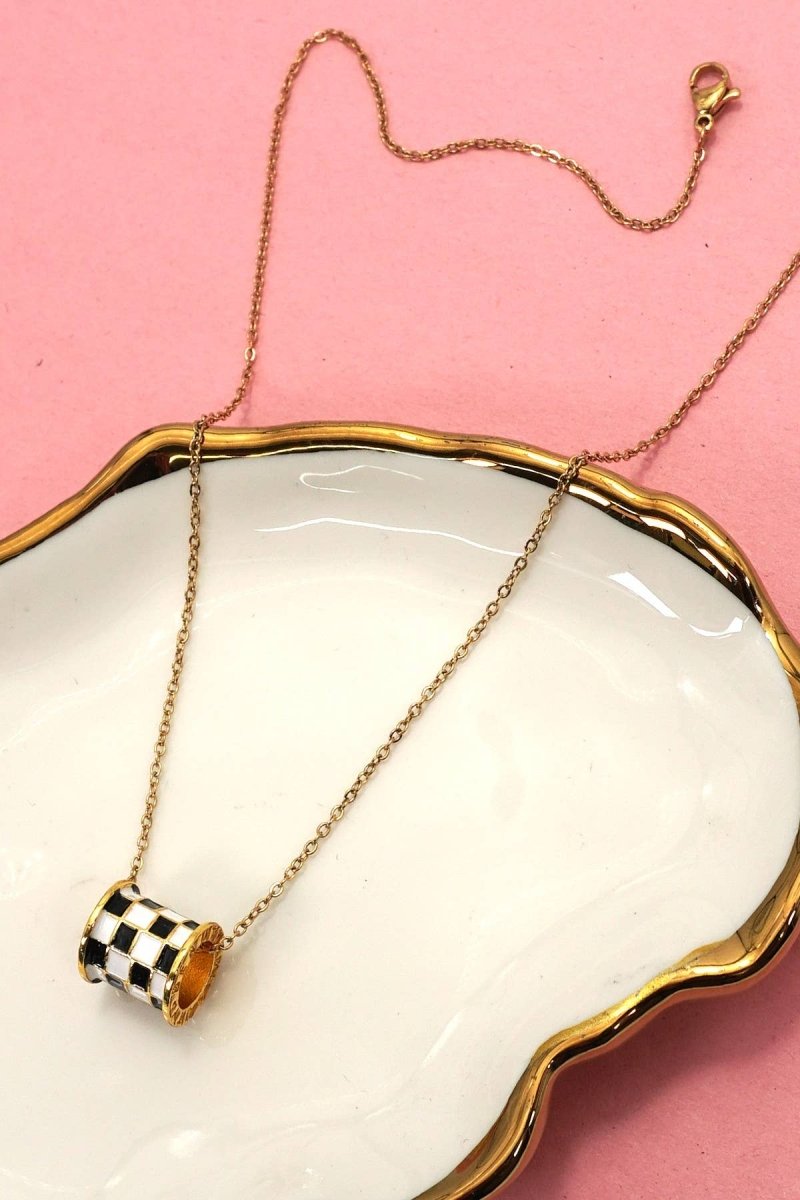 Tarnish-free stainless steel barrel necklace with checkered enamel pendant