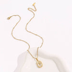 Tarnish-free stainless steel necklace with gold tulip enamel pendant