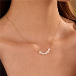 Tarnish-free stainless steel necklace with faux pearl accent