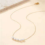Tarnish-free stainless steel necklace with faux pearl accent