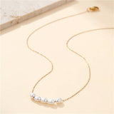 Tarnish-free stainless steel necklace with faux pearl accent