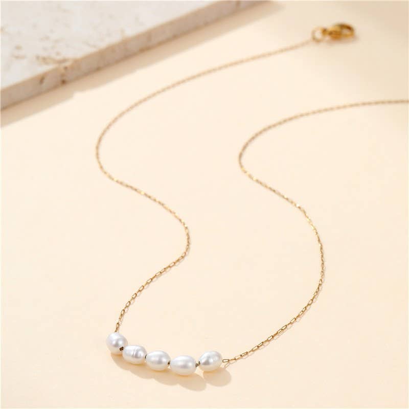 Tarnish-free stainless steel necklace with faux pearl accent