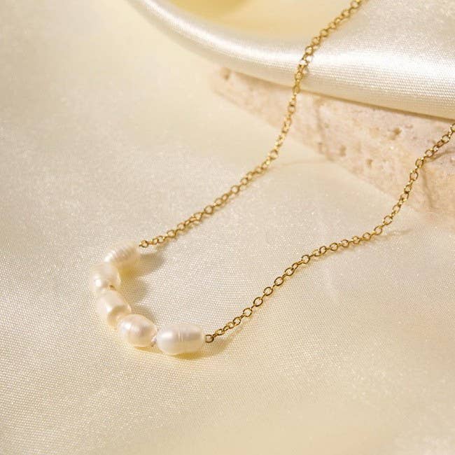 Tarnish-free stainless steel necklace with faux pearl accent
