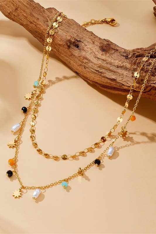 Tarnish-free stainless steel necklace with seed bead flowers and pearl drop