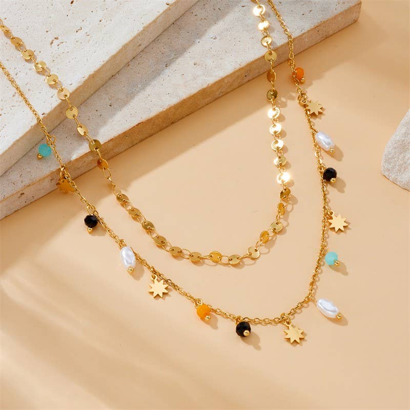 Tarnish-free stainless steel necklace with seed bead flowers and pearl drop