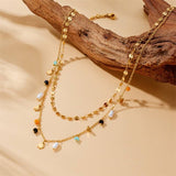 Tarnish-free stainless steel necklace with seed bead flowers and pearl drop