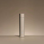 Aura House diffuser styled on a console table in a living room setting