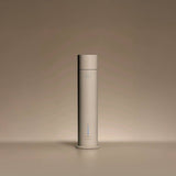 Aura House diffuser styled on a console table in a living room setting
