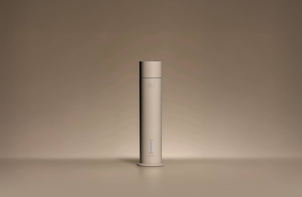 Aura House diffuser styled on a console table in a living room setting