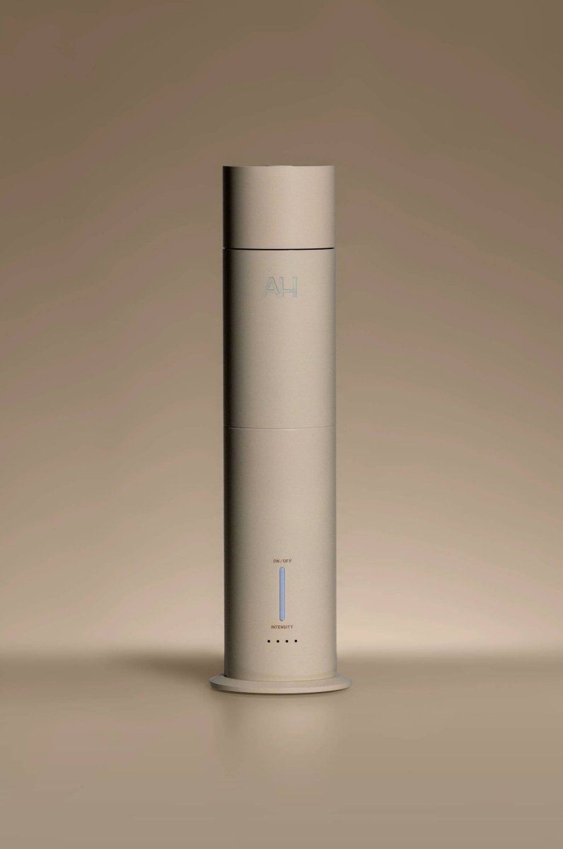 Aura House diffuser standing tall, showing its slim aluminum silhouette