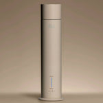 Aura House diffuser standing tall, showing its slim aluminum silhouette