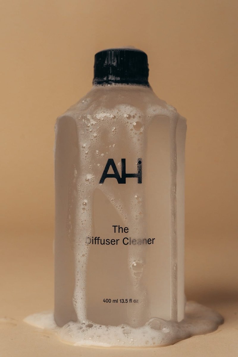 Aura House Diffuser Cleaner styled beside the diffuser it maintains