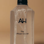 Aura House Diffuser Cleaner styled beside the diffuser it maintains