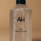 Aura House Diffuser Cleaner styled beside the diffuser it maintains