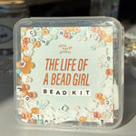 Bead kit packaging with decorative text and bead designs on a light background