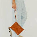 Woven vegan leather convertible crossbody and clutch bag