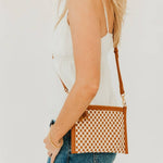 Woven vegan leather convertible crossbody and clutch bag