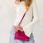 Woven vegan leather convertible crossbody and clutch bag