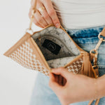 Woven vegan leather convertible crossbody and clutch bag
