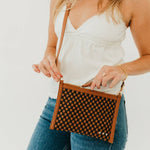 Woven vegan leather convertible crossbody and clutch bag