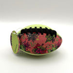 Colorful football with tropical pattern on a white background