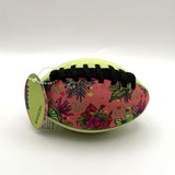 Colorful football with tropical pattern on a white background
