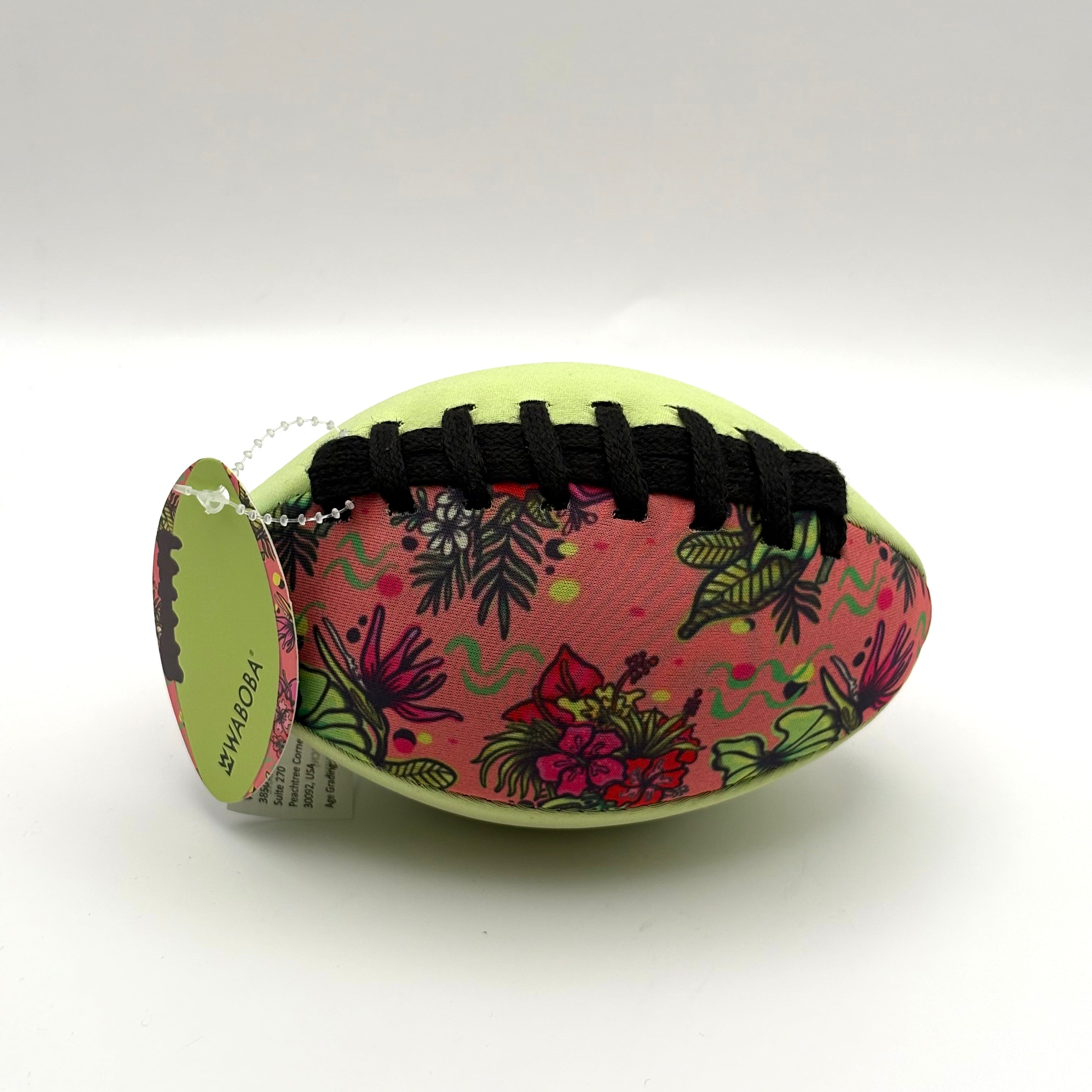 Colorful football with tropical pattern on a white background