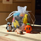 Wigglitz toys on a crate with a bag filled of toys and a display of a beaver, carrot, and a beaver
